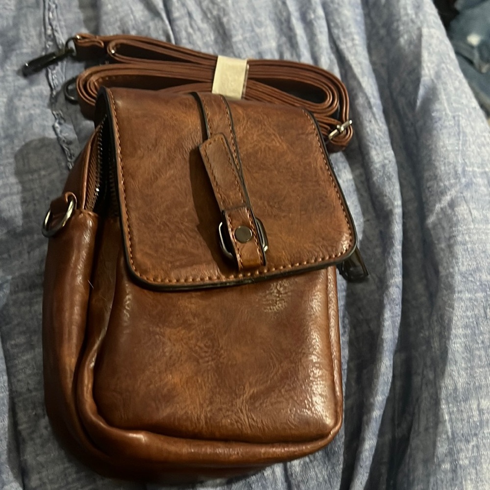 brown cross over purse . bought and never used . strap included